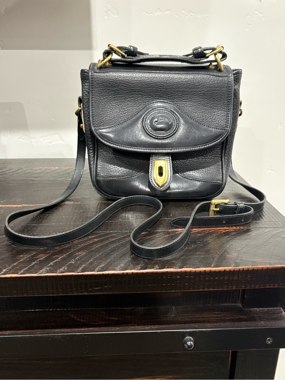 Dooney & Bourke Vintage Black Leather Crossbody with Gold-Tone Accents